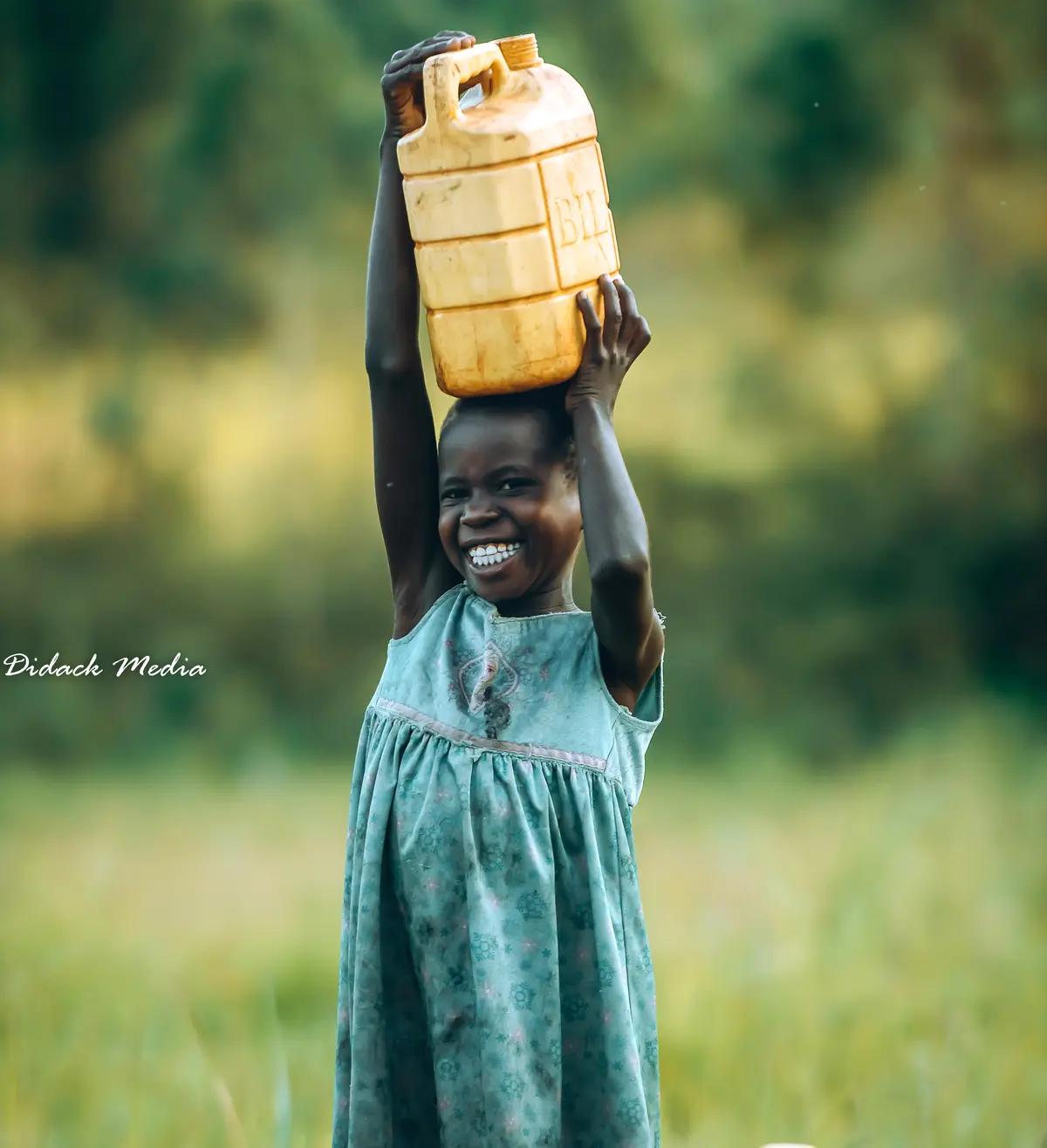 A girl carrying water jerican in Jinja Uganda