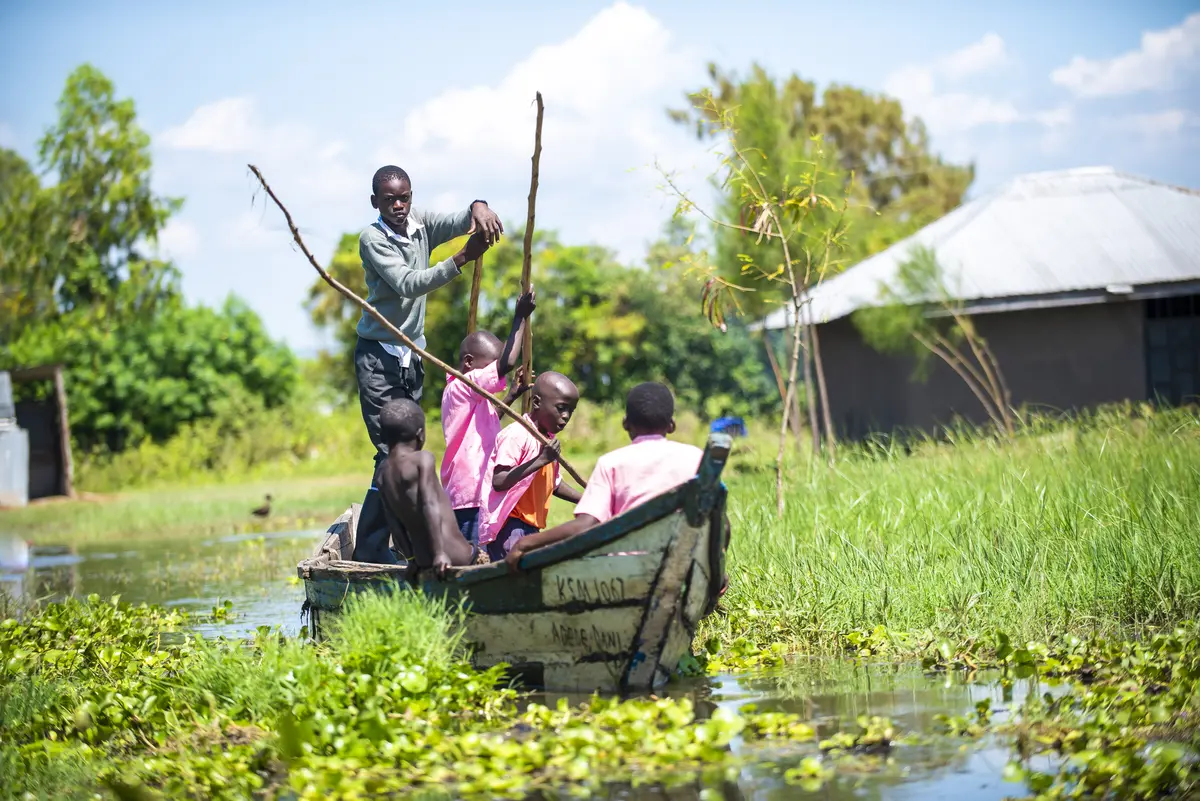 Children using boats to get to school in Homa Bay after floods cut off roads.