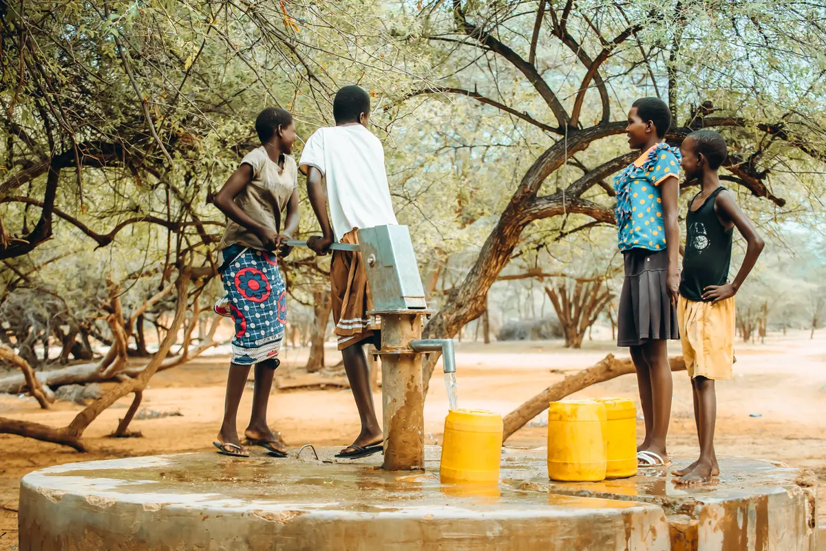 Girls fetch water from a borehole in Turkana County amid ongoing water shortages.