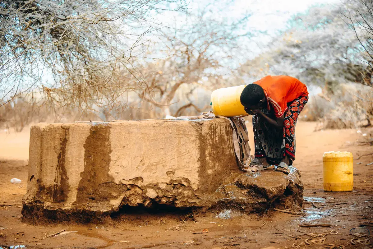 A boy drinks water from a borehole in Wajir amid ongoing water scarcity in the region.
